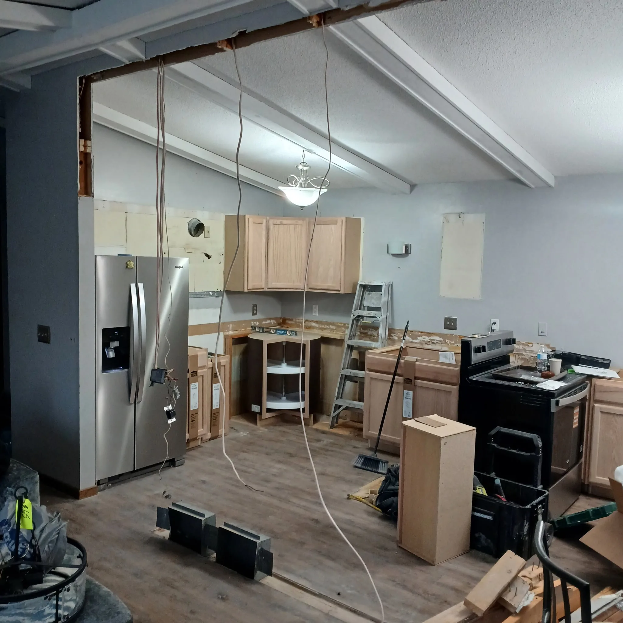 Kitchen remodel with white cabinets and quartz countertops